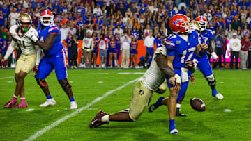 Florida State Seminoles defensive lineman Jared Verse (5) sacks Florida Gators quarterback Max Brown (17) at Steve Spurrier Field at Ben Hill Griffin Stadium in Gainesville, FL on Saturday, November 25, 2023 during the second half. Florida State won 24-15. [Doug Engle/Gainesville Sun]