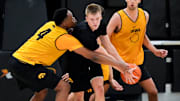 Iowa’s Cam Manyawu (4) tries to knock the ball away from Bennett Stirtz (14) during practice June 19, 2025 at Carver-Hawkeye Arena in Iowa City, Iowa.
