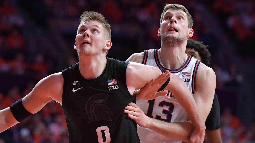 Feb 15, 2025; Champaign, Illinois, USA;  Michigan State Spartans forward Jaxon Kohler (0) and Illinois Fighting Illini center Tomislav Ivisic (13) battle for position during the first half at State Farm Center. Mandatory Credit: Ron Johnson-Imagn Images