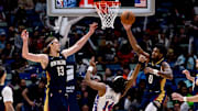 Former Husky Keion Brooks Jr. (0) grabs a rebound for the New Orleans Pelicans.