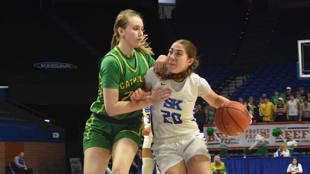 Simon Kenton guard Bella Ober tries to drive around an Owensboro Catholic defender in a Kentucky girls state quarterfinal game March 13, 2026. 