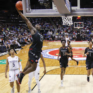 Mar 28, 2018; Atlanta, GA, USA; McDonalds All-American East forward Zion Williamson (12) dunks against the West in the second half of the McDonalds High School All American Game  at Philips Arena. Mandatory Credit: Brett Davis-Imagn Images