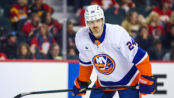 Jan 17, 2026; Calgary, Alberta, CAN; New York Islanders defenseman Scott Mayfield (24) against the Calgary Flames during the first period at Scotiabank Saddledome. Mandatory Credit: Sergei Belski-Imagn Images