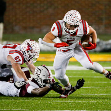 Nixa's Dylan Rebura carries the ball as the Eagles took on the De Smet Spartans in the Class 6 State Championship game at Faurot Field in Columbia, Mo. on Friday, Dec. 6, 2024.