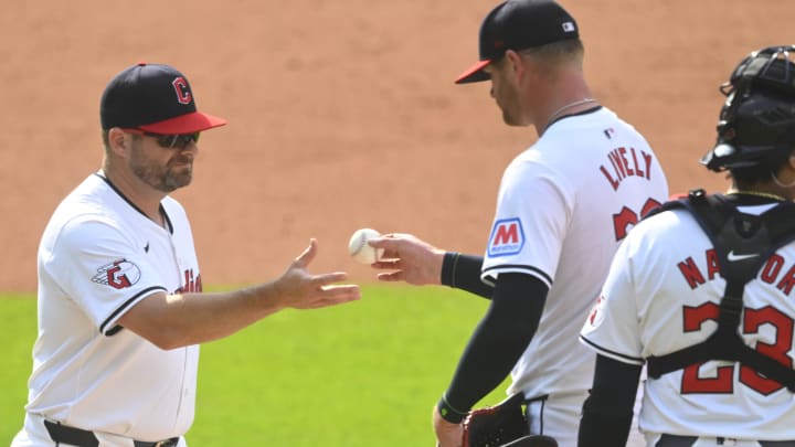 Jun 22, 2024; Cleveland, Ohio, USA; Cleveland Guardians manager Stephen Vogt (12) takes the ball from starting pitcher Ben Lively (39) during a pitching change in the sixth inning against the Toronto Blue Jays at Progressive Field. Mandatory Credit: David Richard-USA TODAY Sports