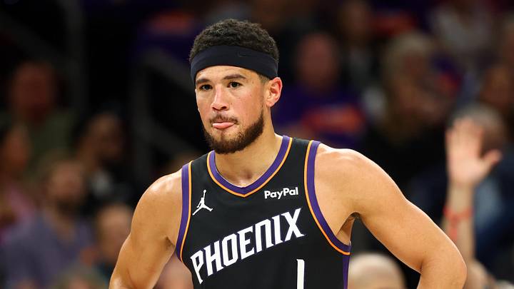 Apr 14, 2026; Phoenix, Arizona, USA; Phoenix Suns guard Devin Booker (1) reacts against the Portland Trail Blazers in the first half during the play-in rounds of the 2026 NBA Playoffs at Mortgage Matchup Center. Mandatory Credit: Mark J. Rebilas-Imagn Images