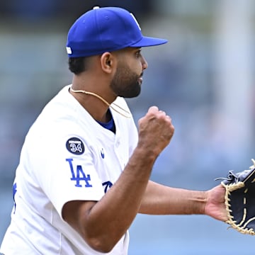 Dodgers pitcher Yoendrys Gomez (94) celebrates after throwing a strike to defeat the Pittsburgh Pirates during the ninth inning at Dodger Stadium on Apr 27, 2025.
