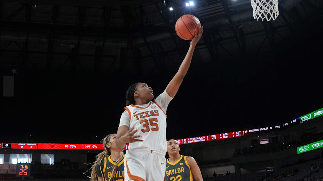Dec 14, 2025; Fort Worth, Texas, USA; Texas Longhorns forward Madison Booker (35) scores a layup ahead of Baylor Bears forward Darianna Littlepage-Buggs (5) during the first half at Dickies Arena. Mandatory Credit: Chris Jones-Imagn Images Dec 14, 2025; Fort Worth, Texas, USA; Texas Longhorns forward Madison Booker (35) scores a layup ahead of Baylor Bears forward Darianna Littlepage-Buggs (5) during the first half at Dickies Arena. Mandatory Credit: Chris Jones-Imagn Images