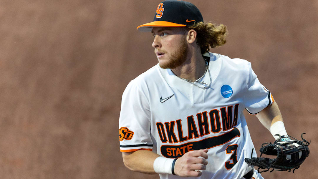 May 31, 2024; Stillwater, OK, USA; Oklahoma State utility Carson Benge (3) catches the ball in the outfield during a regional NCAA Baseball game against Niagara at O'Brate Stadium. Mandatory Credit: Mitch Alcala-For The Oklahoman