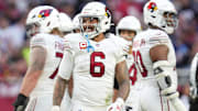 Arizona Cardinals running back James Conner (6) smiles as he comes out the huddle during their game against the New England Patriots at State Farm Stadium on Dec 15, 2024.