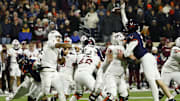 Nov 29, 2025; Charlottesville, Va.; Virginia defensive end Fisher Camac (14) tips a pass by Virginia Tech quarterback Kyron Drones (1) resulting in an interception.