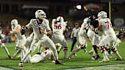Nov 29, 2025; Charlottesville, Virginia, USA; Virginia Tech Hokies quarterback Kyron Drones (1) passes the ball from his own end zone against the Virginia Cavaliers in the third quarter at Scott Stadium. Mandatory Credit: Geoff Burke-Imagn Images
