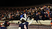 Nov 29, 2025; Charlottesville, Virginia, USA; Virginia Cavaliers quarterback Chandler Morris (4) celebrates with fans after the Cava;liers' game against the Virginia Tech Hokies at Scott Stadium. Mandatory Credit: Geoff Burke-Imagn Images