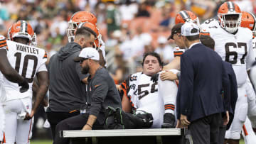 Aug 10, 2024; Cleveland, Ohio, USA; Cleveland Browns center Luke Wypler (56) rides the medical cart back to the locker room following an injury during the second quarter against the Green Bay Packers at Cleveland Browns Stadium. Mandatory Credit: Scott Galvin-USA TODAY Sports