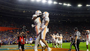 Nov 22, 2025; Gainesville, Florida, USA; Tennessee Volunteers tight end Ethan Davis (0) celebrates a touchdown with quarterback Joey Aguilar (6) against the Florida Gators during the first half at Ben Hill Griffin Stadium. Mandatory Credit: Matt Pendleton-Imagn Images