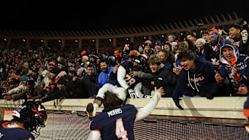 Nov 29, 2025; Charlottesville, Virginia, USA; Virginia Cavaliers quarterback Chandler Morris (4) celebrates with fans after the Cava;liers' game against the Virginia Tech Hokies at Scott Stadium. Mandatory Credit: Geoff Burke-Imagn Images
