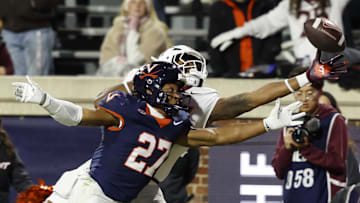 Nov 29, 2025; Charlottesville, Virginia, USA; Virginia Tech Hokies tight end Ja'Ricous Hairston (13) attempts to catch a pass as Virginia Cavaliers safety Devin Neal (27) defendds in the first quarter at Scott Stadium. Mandatory Credit: Geoff Burke-Imagn Images