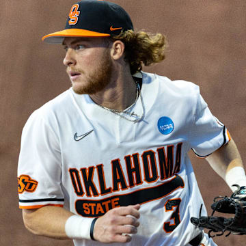 May 31, 2024; Stillwater, OK, USA; Oklahoma State utility Carson Benge (3) catches the ball in the outfield during a regional NCAA Baseball game against Niagara at O'Brate Stadium. Mandatory Credit: Mitch Alcala-For The Oklahoman