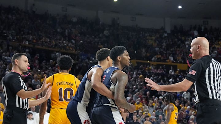 Feb 1, 2025; Tempe, Ariz., U.S.; Arizona State Sun Devils guard BJ Freeman (10) and Arizona Wildcats guard Caleb Love (1) both get ejected at end of a Big 12 menÕs basketball game at Desert Financial Arena.