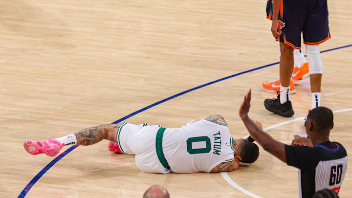 May 12, 2025; New York, New York, USA; Boston Celtics forward Jayson Tatum (0) reacts on the court after an injury in the second half during game four of the second round for the 2025 NBA Playoffs against the New York Knicks at Madison Square Garden. Tatum would leave the game with an injury after this play. Mandatory Credit: Vincent Carchietta-Imagn Images May 12, 2025; New York, New York, USA; Boston Celtics forward Jayson Tatum (0) reacts on the court after an injury in the second half during game four of the second round for the 2025 NBA Playoffs against the New York Knicks at Madison Square Garden. Tatum would leave the game with an injury after this play. Mandatory Credit: Vincent Carchietta-Imagn Images