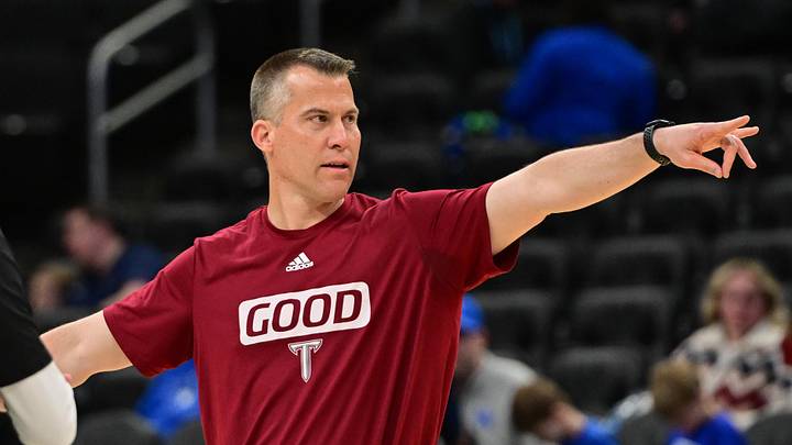 Mar 20, 2025; Milwaukee, WI, USA;  Troy Trojans head coach Scott Cross watches team workout during NCAA Tournament First Round Practice at Fiserv Forum. Mandatory Credit: Benny Sieu-Imagn Images