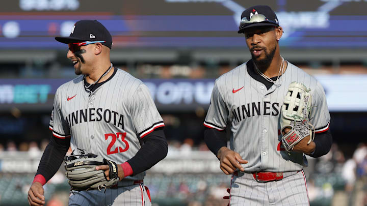 Jul 26, 2024; Detroit, Michigan, USA; Minnesota Twins outfielder Byron Buxton (25) and third baseman Royce Lewis (23) return to the dugout after the first inning of the game against the Detroit Tigers at Comerica Park. Mandatory Credit: Brian Bradshaw Sevald-Imagn Images
