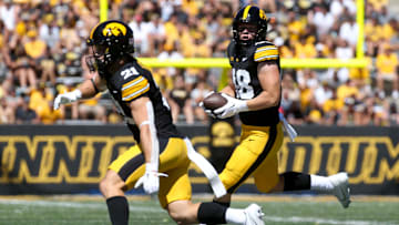 Iowa’s Zach Ortwerth (48) looks to gain extra yards after a catch against Illinois State Saturday, Aug. 31, 2024 at Kinnick Stadium in Iowa City, Iowa.