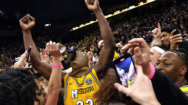 Missouri center Josh Gray (33) celebrates with fans after an upset win against No. 1 ranked rival Kansas Sunday.