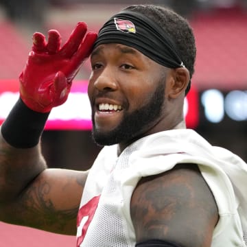 Arizona Cardinals safety Budda Baker (3) acknowledges the fans in the stands during training camp at State Farm Stadium in Glendale on July 25, 2024.