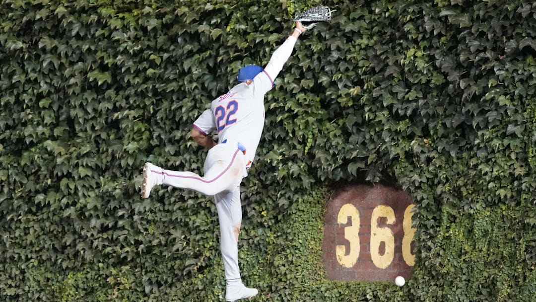 Sep 23, 2025; Chicago, Illinois, USA; New York Mets outfielder Juan Soto (22) can’t make a catch on a two-run double hit by Chicago Cubs first baseman Carlos Santana (not pictured) during the first inning at Wrigley Field. Mandatory Credit: David Banks-Imagn Images