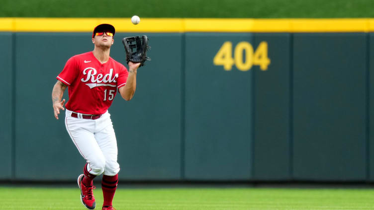 Cincinnati Reds center fielder Nick Senzel (15) catches a fly ball.