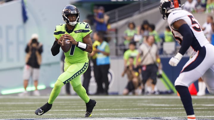 Sep 12, 2022; Seattle, Washington, USA; Seattle Seahawks quarterback Geno Smith (7) looks to pass against the Denver Broncos during the second quarter at Lumen Field. Mandatory Credit: Joe Nicholson-Imagn Images