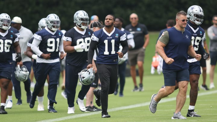 Jun 4, 2024; Frisco, TX, USA; Dallas Cowboys linebacker Micah Parsons (11) runs on the field during practice at the Ford Center at the Star Training Facility in Frisco, Texas. 