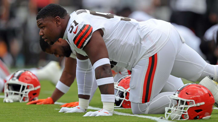 Cleveland Browns defensive tackle Mike Hall Jr. (51) stretches before an NFL preseason football game at Cleveland Browns Stadium, Saturday, Aug. 10, 2024, in Cleveland, Ohio.