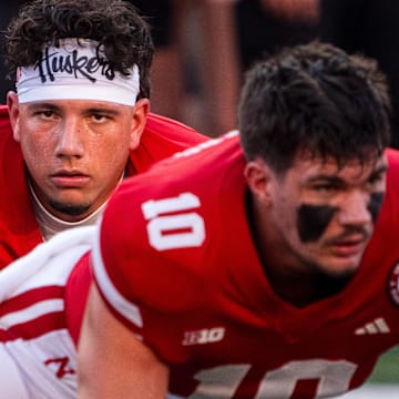 Sep 14, 2024; Lincoln, Nebraska, USA; Nebraska Cornhuskers quarterback Dylan Raiola (15) and quarterback Heinrich Haarberg (10) warm up before the game against the Northern Iowa Panthers at Memorial Stadium. 