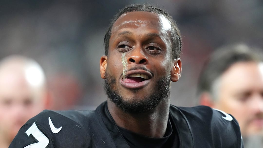 (EDITORS NOTE: obscene gesture in photo) Nov 23, 2025; Paradise, Nevada, USA; Vegas Raiders quarterback Geno Smith (7) gestures towards a fan after the Cleveland Browns defeated the Raiders 24-10 at Allegiant Stadium. Mandatory Credit: Stephen R. Sylvanie-Imagn Images 