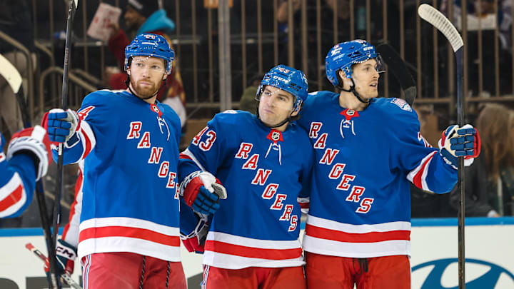 Apr 5, 2026; New York, New York, USA; New York Rangers left wing Conor Sheary (43) celebrates his goal against the Washington Capitals with defenseman Vladislav Gavrikov (44) and left wing Tye Kartye (24) during the first period at Madison Square Garden.