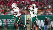 Sep 21, 2024; Tampa, Florida, USA; Miami Hurricanes quarterback Cam Ward (1) throws a pass against the South Florida Bulls in the third quarter at Raymond James Stadium. Mandatory Credit: Nathan Ray Seebeck-Imagn Images
