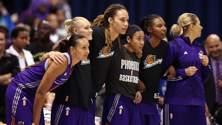 Sep 12, 2014; Chicago, IL, USA; Phoenix Mercury center Brittney Griner (middle) and teammates link arms as they watch during the fourth quarter against the Chicago Sky in game three of the 2014 WNBA Finals at UIC Pavilion. Mandatory Credit: Jerry Lai-Imagn Images Sep 12, 2014; Chicago, IL, USA; Phoenix Mercury center Brittney Griner (middle) and teammates link arms as they watch during the fourth quarter against the Chicago Sky in game three of the 2014 WNBA Finals at UIC Pavilion. Mandatory Credit: Jerry Lai-Imagn Images