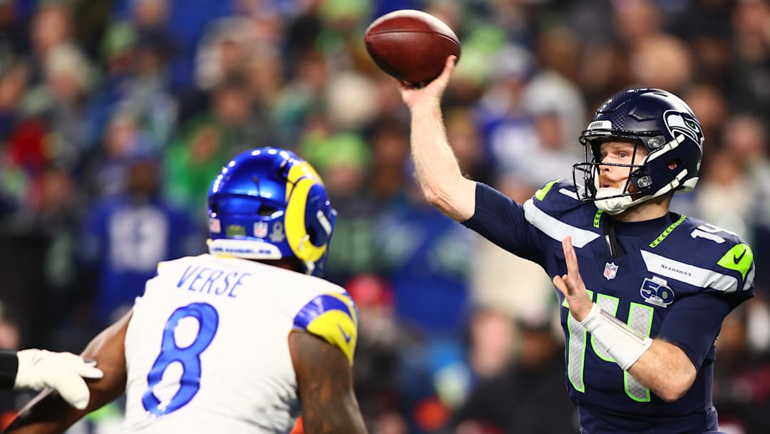 Jan 25, 2026; Seattle, WA, USA; Seattle Seahawks quarterback Sam Darnold (14) throws against Los Angeles Rams linebacker Jared Verse (8) during the second half in the 2026 NFC Championship Game at Lumen Field. Mandatory Credit: Kevin Ng-Imagn Images