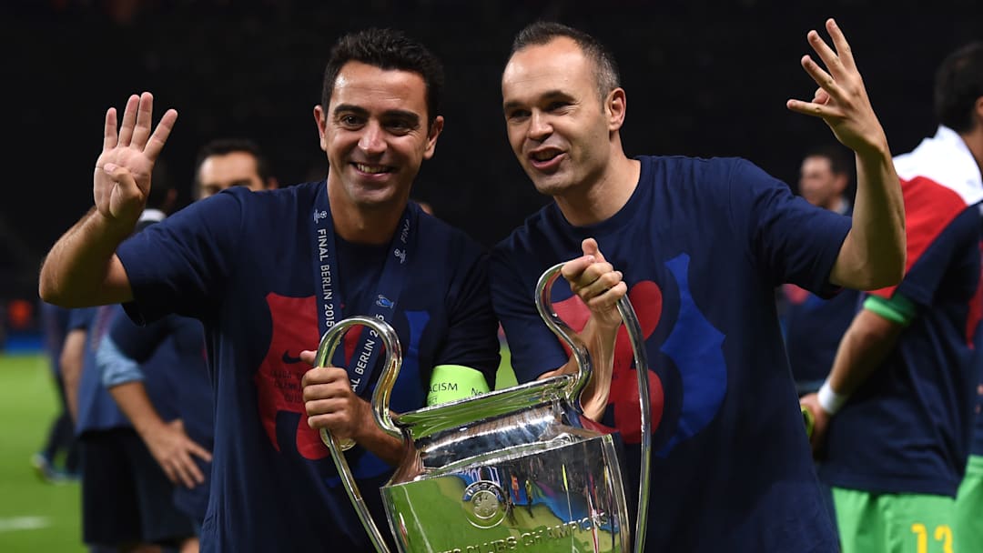 Xavi Hernández (left) and Andrés Iniesta won four Champions League titles together at Barcelona.