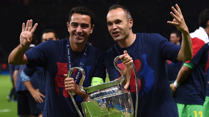 Xavi Hernández (left) and Andrés Iniesta won four Champions League titles together at Barcelona.
