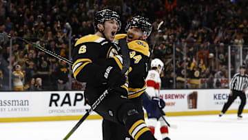 Mar 11, 2025; Boston, Massachusetts, USA; Boston Bruins defenseman Mason Lohrei (6) celebrates his game tying goal against the Florida Panthers with center Jakub Lauko (94) during the third period at TD Garden. Mandatory Credit: Winslow Townson-Imagn Images