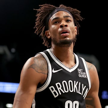 Mar 28, 2025; Brooklyn, New York, USA; Brooklyn Nets center Nic Claxton (33) reacts during the first quarter against the Los Angeles Clippers at Barclays Center. Mandatory Credit: Brad Penner-Imagn Images