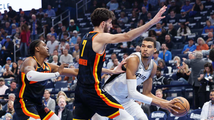 Nov 14, 2023; Oklahoma City, Oklahoma, USA; Oklahoma City Thunder forward Chet Holmgren (7) defends a pass by San Antonio Spurs center Victor Wembanyama (1) during the first quarter at Paycom Center. Mandatory Credit: Alonzo Adams-USA TODAY Sports