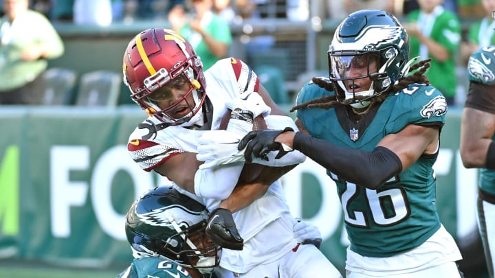 Oct 1, 2023; Philadelphia, Pennsylvania, USA; Washington Commanders wide receiver Jahan Dotson (1) catches touchdown pass against Philadelphia Eagles cornerback Josh Jobe (28) and safety Terrell Edmunds (26) during the fourth quarter at Lincoln Financial Field. Mandatory Credit: Eric Hartline-USA TODAY Sports