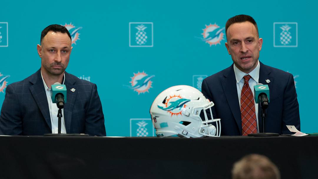 Jan 22, 2026; Miami Gardens, FL, USA; Miami Dolphins head coach Jeff Hafley, right, joined by general manager Jon-Eric Sullivan, left, speak to reporters during their introductory press conference at Baptist Health Training Complex. Mandatory Credit: Sam Navarro-Imagn Images