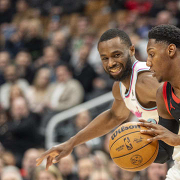 Feb 21, 2025; Toronto, Ontario, CAN; Toronto Raptors guard RJ Barrett (9) dribbles the ball against Miami Heat forward Andrew Wiggins (22) during first half at Scotiabank Arena. Mandatory Credit: Kevin Sousa-Imagn Images