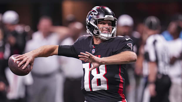 Atlanta, Georgia, USA; Atlanta Falcons quarterback Kirk Cousins (18) warms up on the field before the game against the Jackso