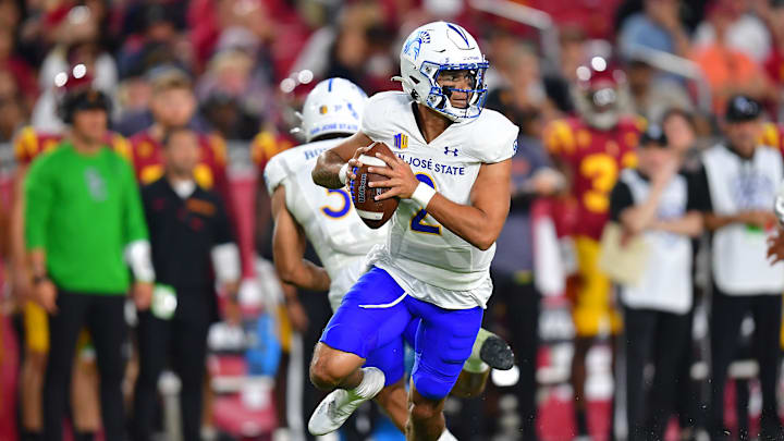 Aug 26, 2023; Los Angeles, California, USA; San Jose State Spartans quarterback Chevan Cordeiro (2) moves out to pass against the Southern California Trojans during the second half at Los Angeles Memorial Coliseum. Mandatory Credit: Gary A. Vasquez-Imagn Images